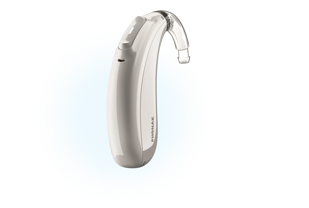 Hearing aid device against blue background, showcasing sleek design and advanced technology for enhanced hearing experience.