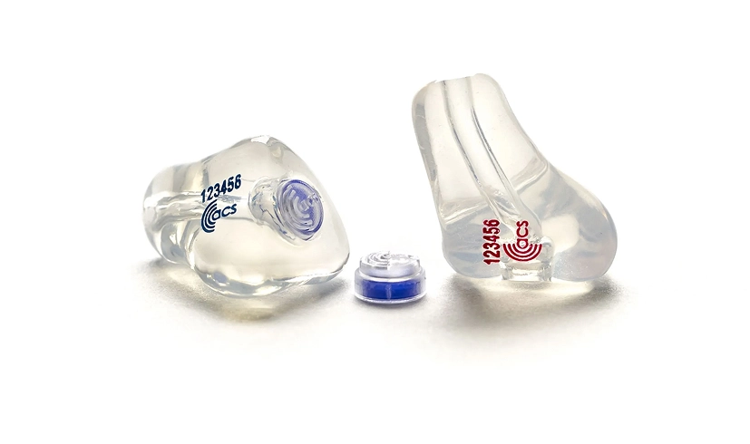 Custom transparent earplugs with noise-canceling filters and branding on a white background.