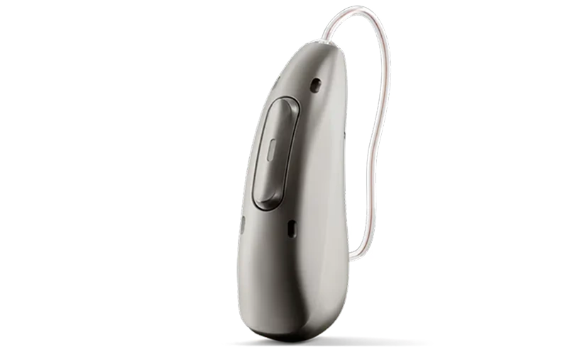 Sleek silver hearing aid with clear tubing, designed for comfort and optimal sound amplification.